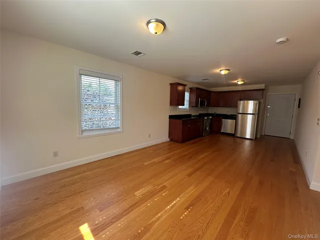 a bathroom with a toilet and a car