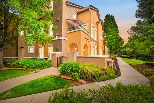 a view of a building with a yard