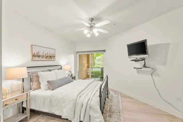 a view of a room with furniture and a window