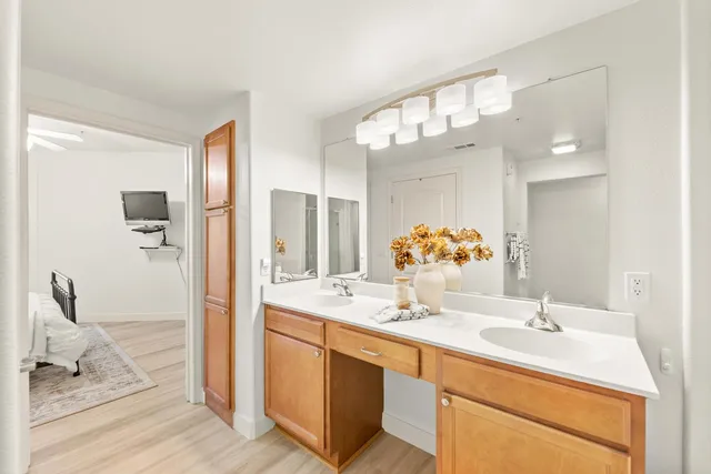 a bathroom with a shower and a glass door