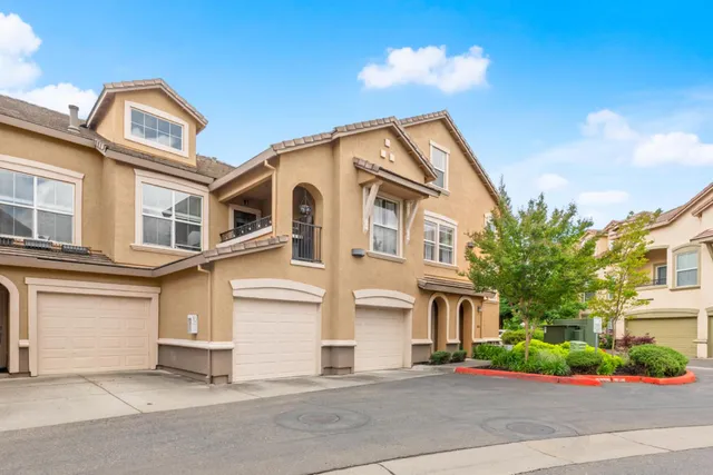 a view of a pathway with a garden