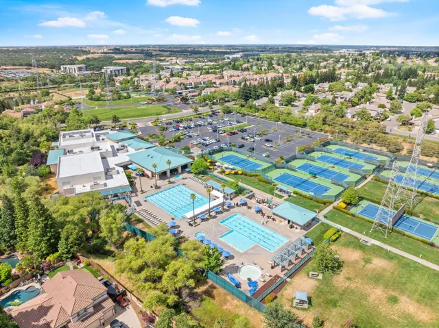 an aerial view of residential houses with outdoor space