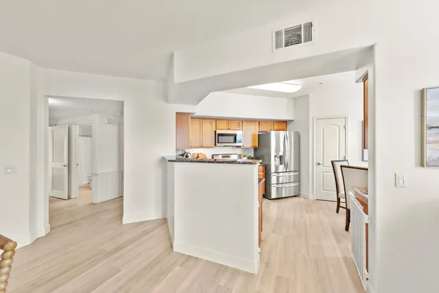 a view of kitchen with furniture and wooden floor