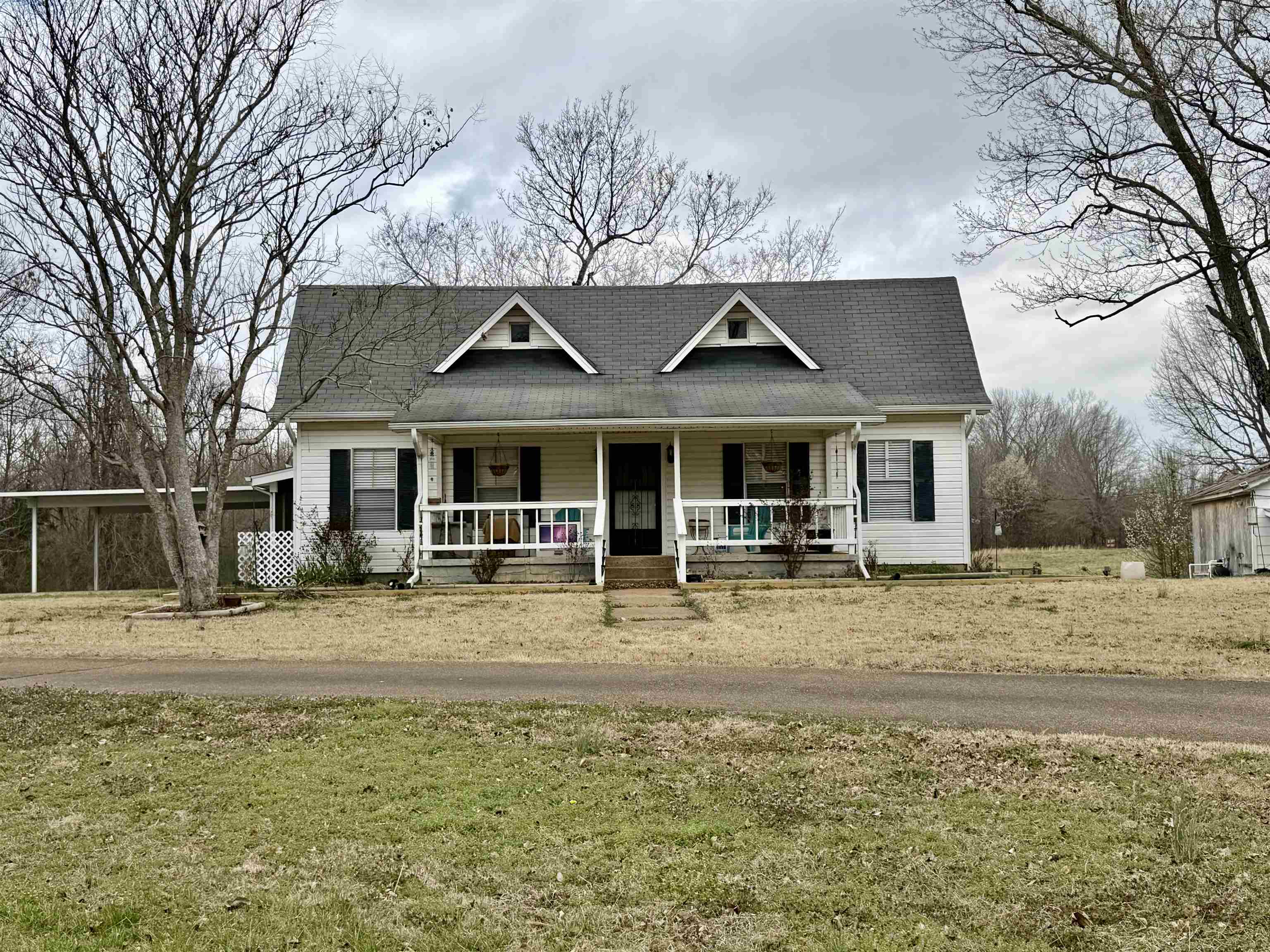9870 Moose Road Millington, TN 38053 - Photo 2 of 6 View of front of home with a porch, a front lawn, and a shingled roof