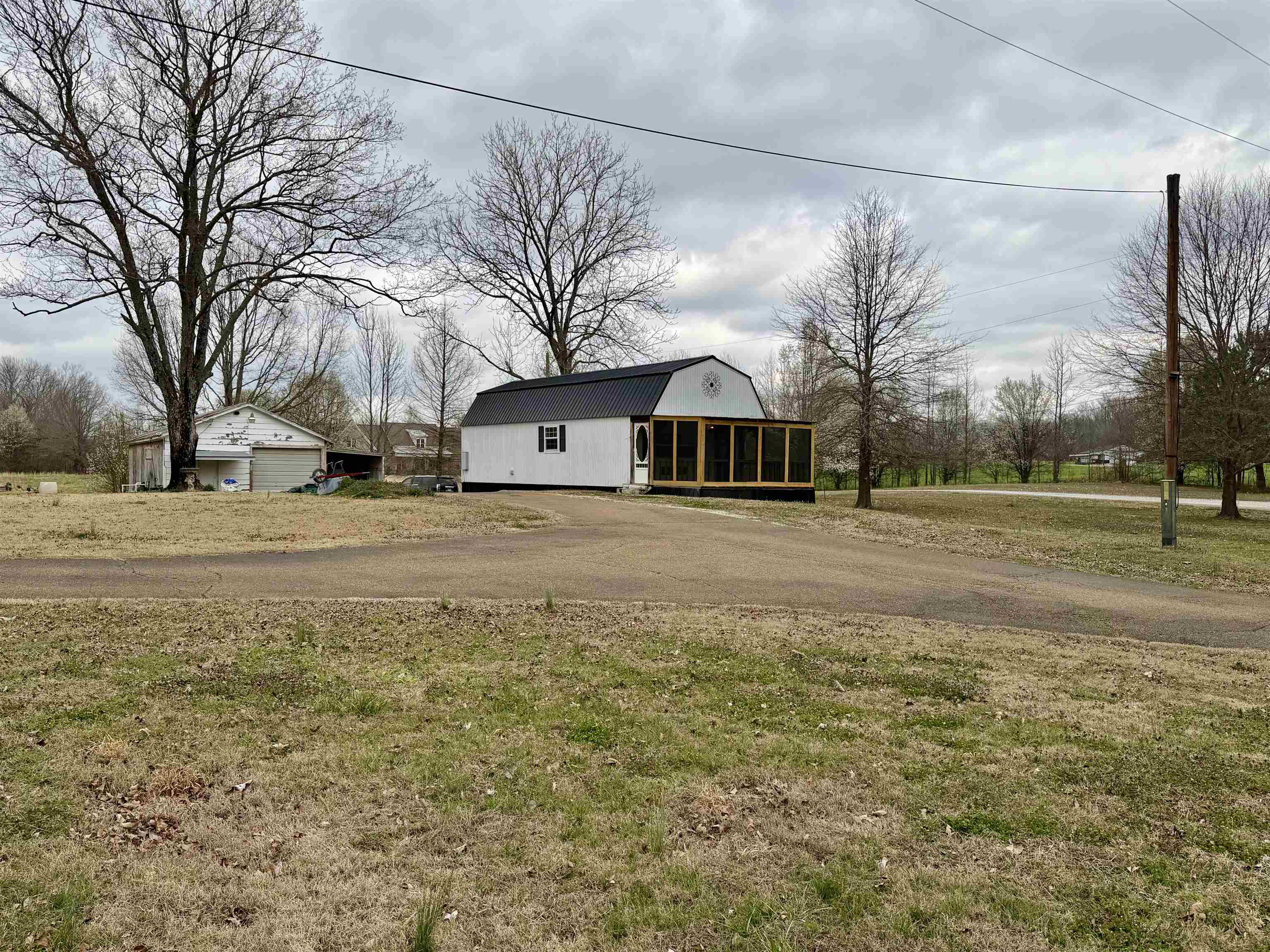 9870 Moose Road Millington, TN 38053 - Photo 3 of 6 View of outbuilding with a sunroom and driveway