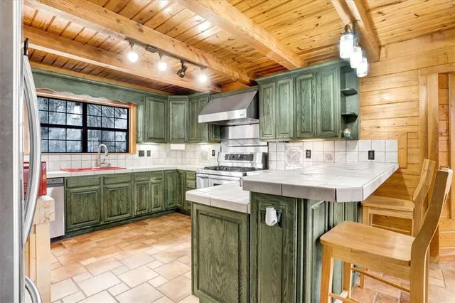 a kitchen with sink and cabinets