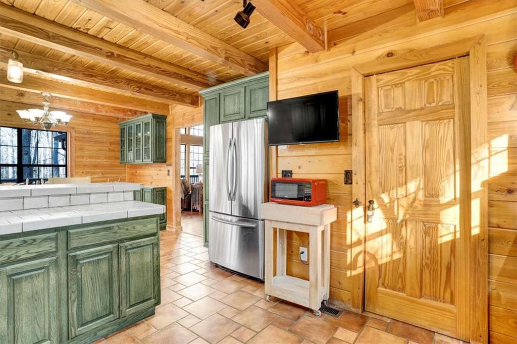 217 Browning Road Villa Rica, GA 30180 - Photo 13 of 40 a kitchen that has a microwave a stove and a refrigerator