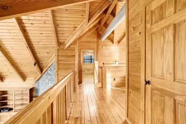 a view of a balcony with wooden floor and door