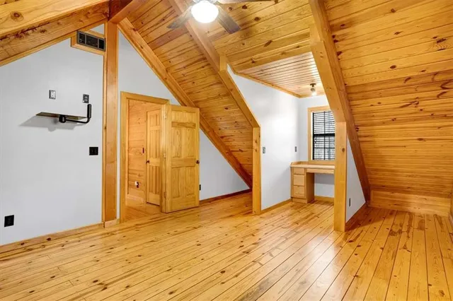 a view of a balcony with wooden floor and staircase
