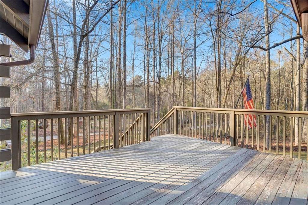 217 Browning Road Villa Rica, GA 30180 - Photo 30 of 40 a balcony with wooden floor and fence