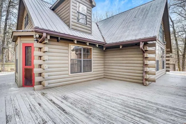 a view of a house with a door and wooden floor