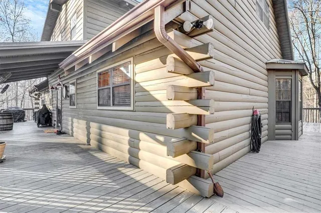 a view of a brick house with large windows