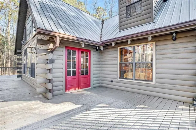 a house view with swimming pool in front of it