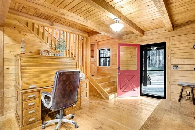a view of entryway with wooden furniture
