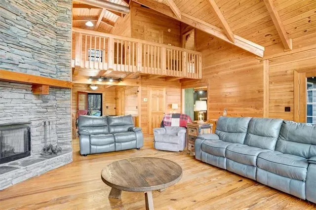 a view of a patio with couches and a fire pit