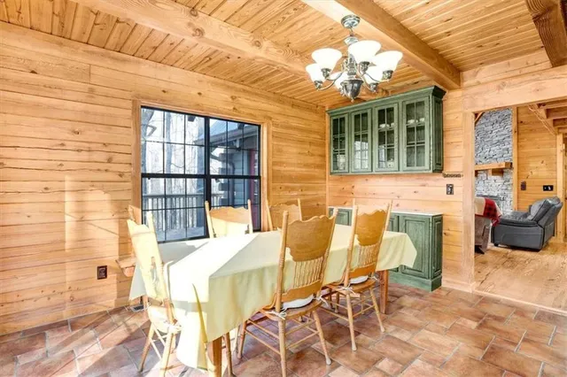 a view of a patio with table and chairs and potted plants