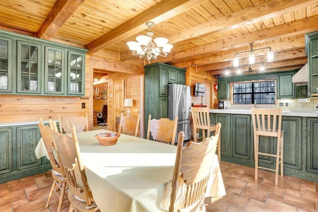217 Browning Road Villa Rica, GA 30180 - Photo 10 of 40 a dining room with furniture and a large window
