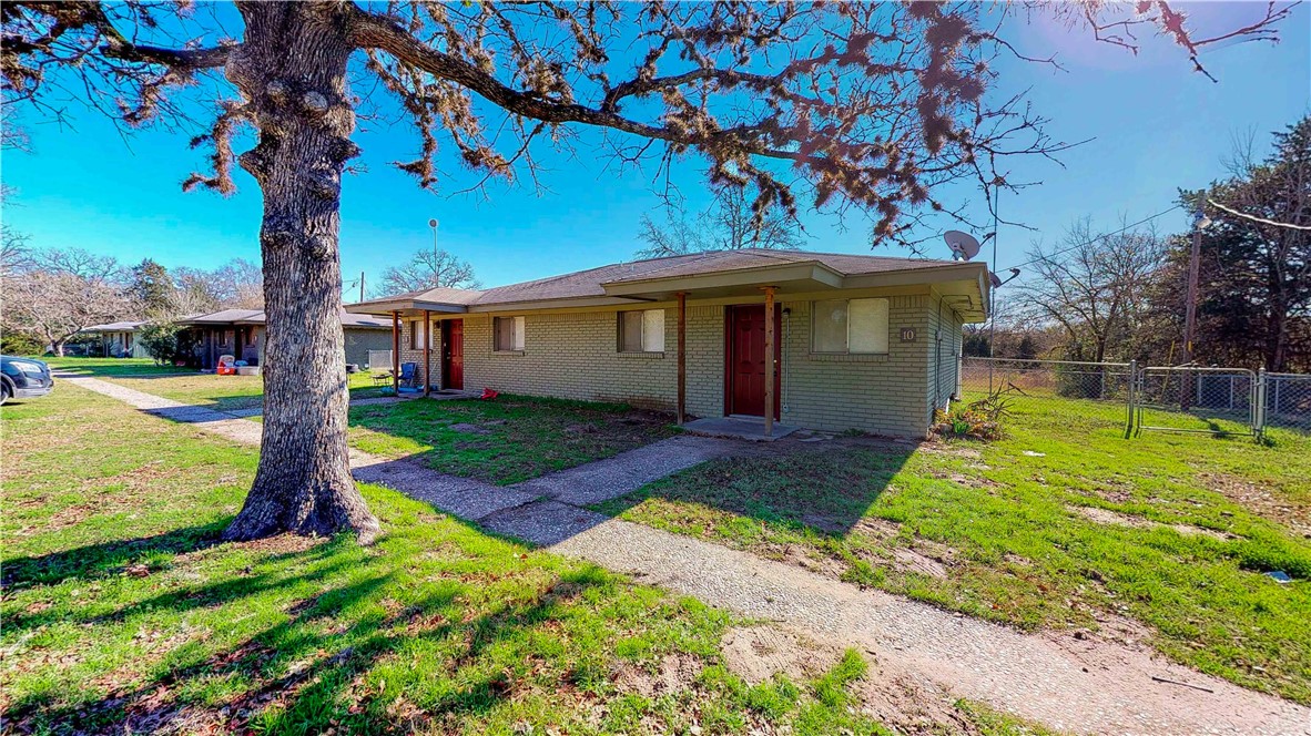 16567 Farm To Market 2154, Unit 10 College Station, TX 77845 - Photo 1 of 1 a front view of a house with garden