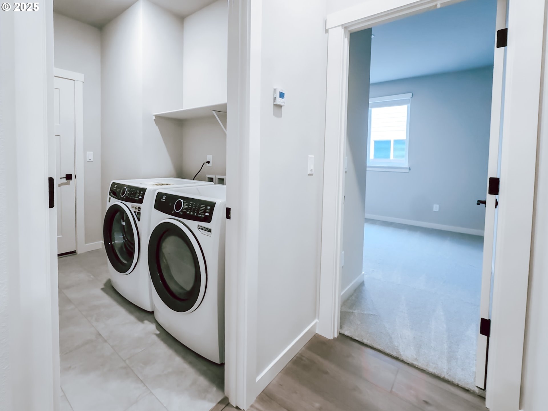 2509 South 4th Way Ridgefield, WA 98642 - Photo 12 of 45 a view of storage and utility room with washer and dryer