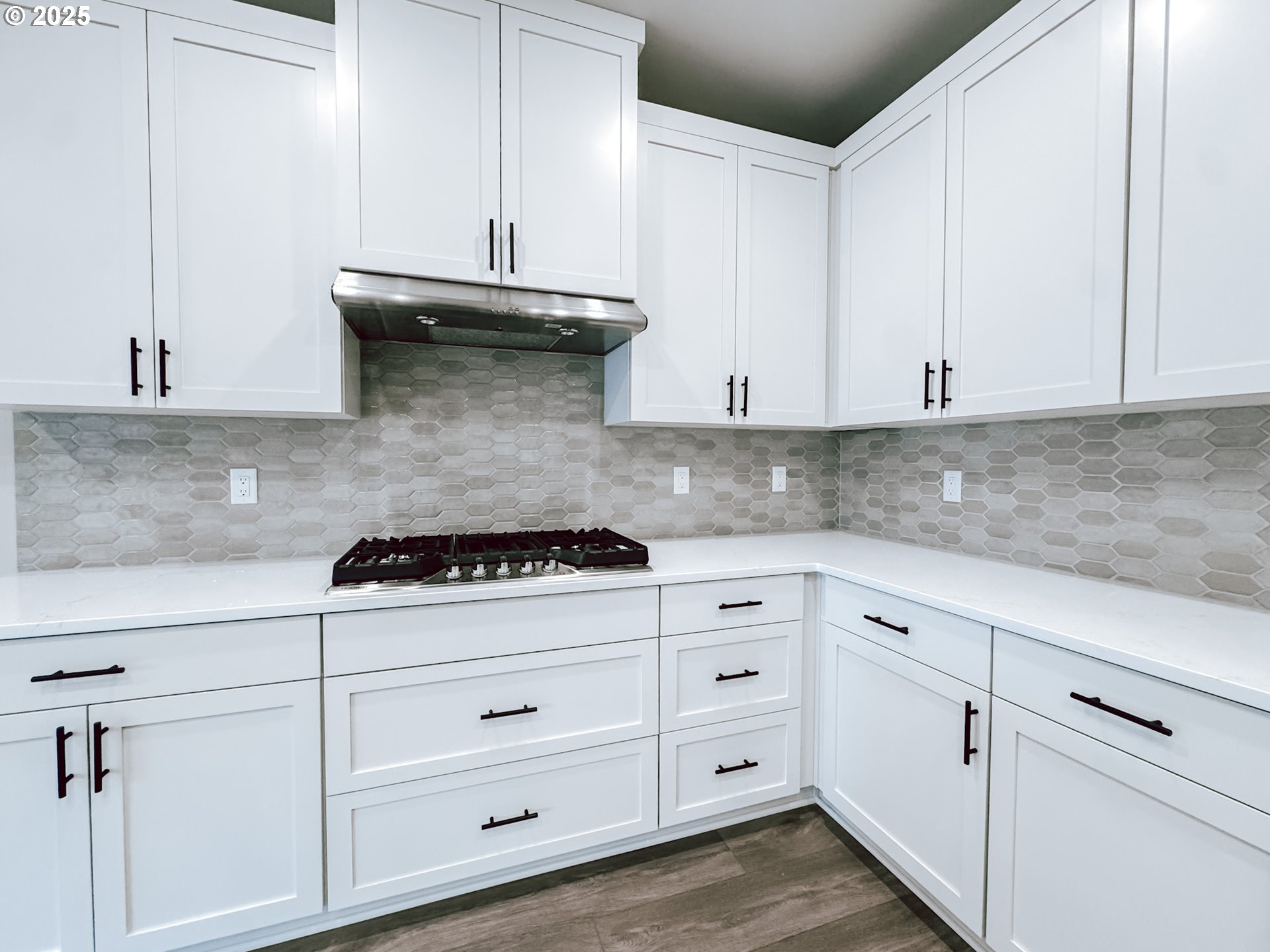 2509 South 4th Way Ridgefield, WA 98642 - Photo 19 of 45 a kitchen with white cabinets and white appliances