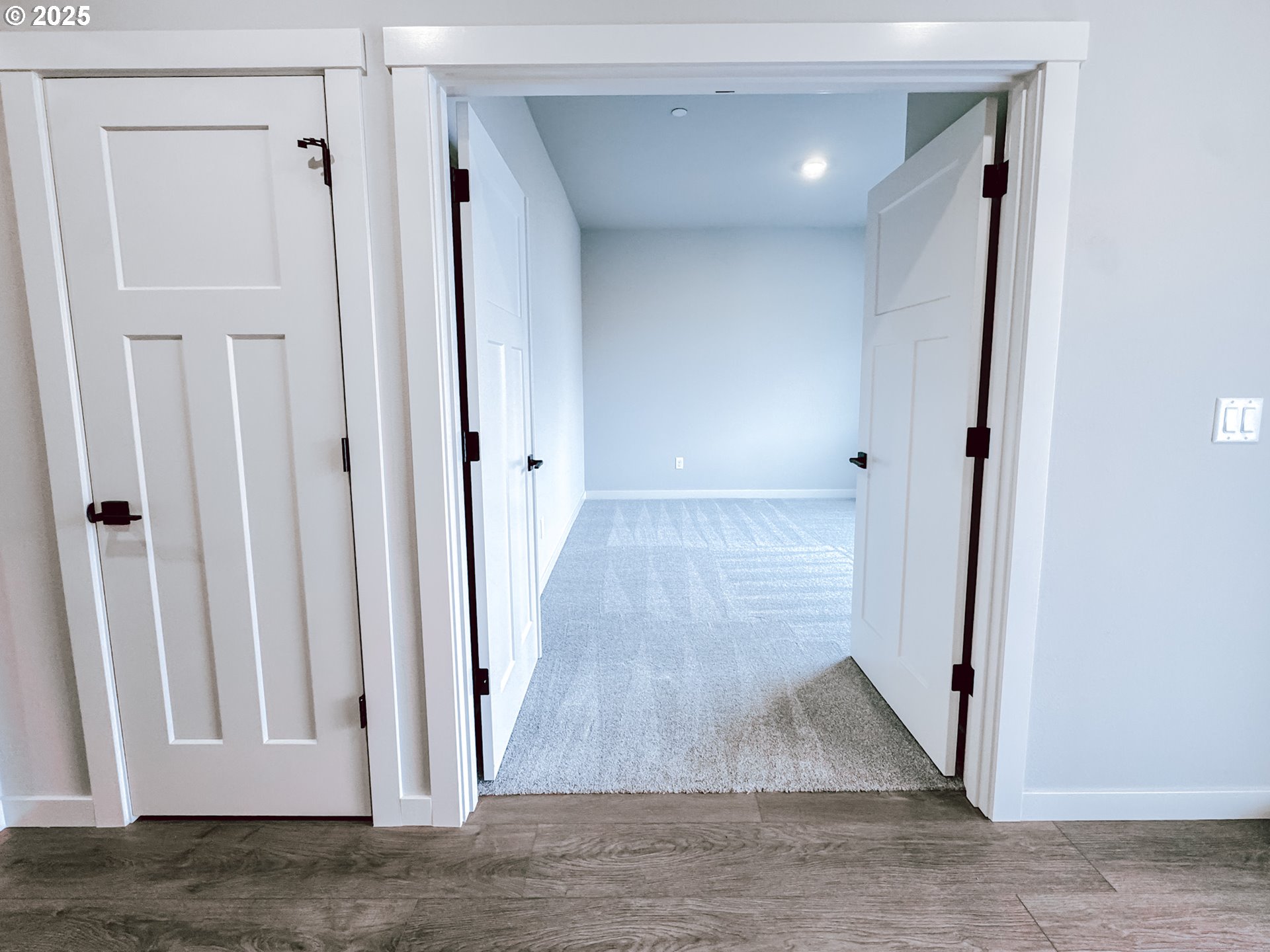 2509 South 4th Way Ridgefield, WA 98642 - Photo 4 of 45 a view of a hallway with wooden floor and staircase