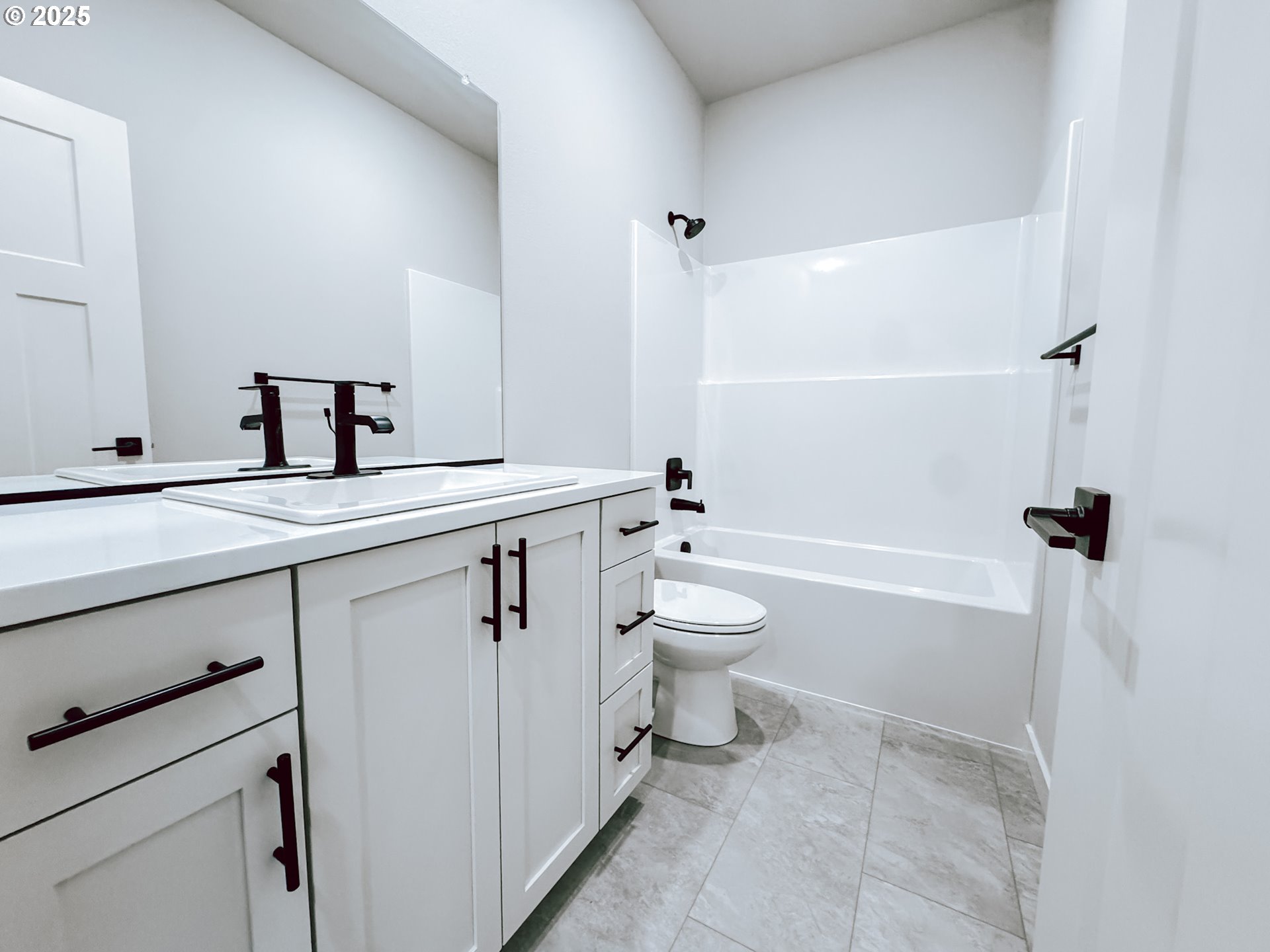 2509 South 4th Way Ridgefield, WA 98642 - Photo 7 of 45 a bathroom with a sink a toilet and a bathtub