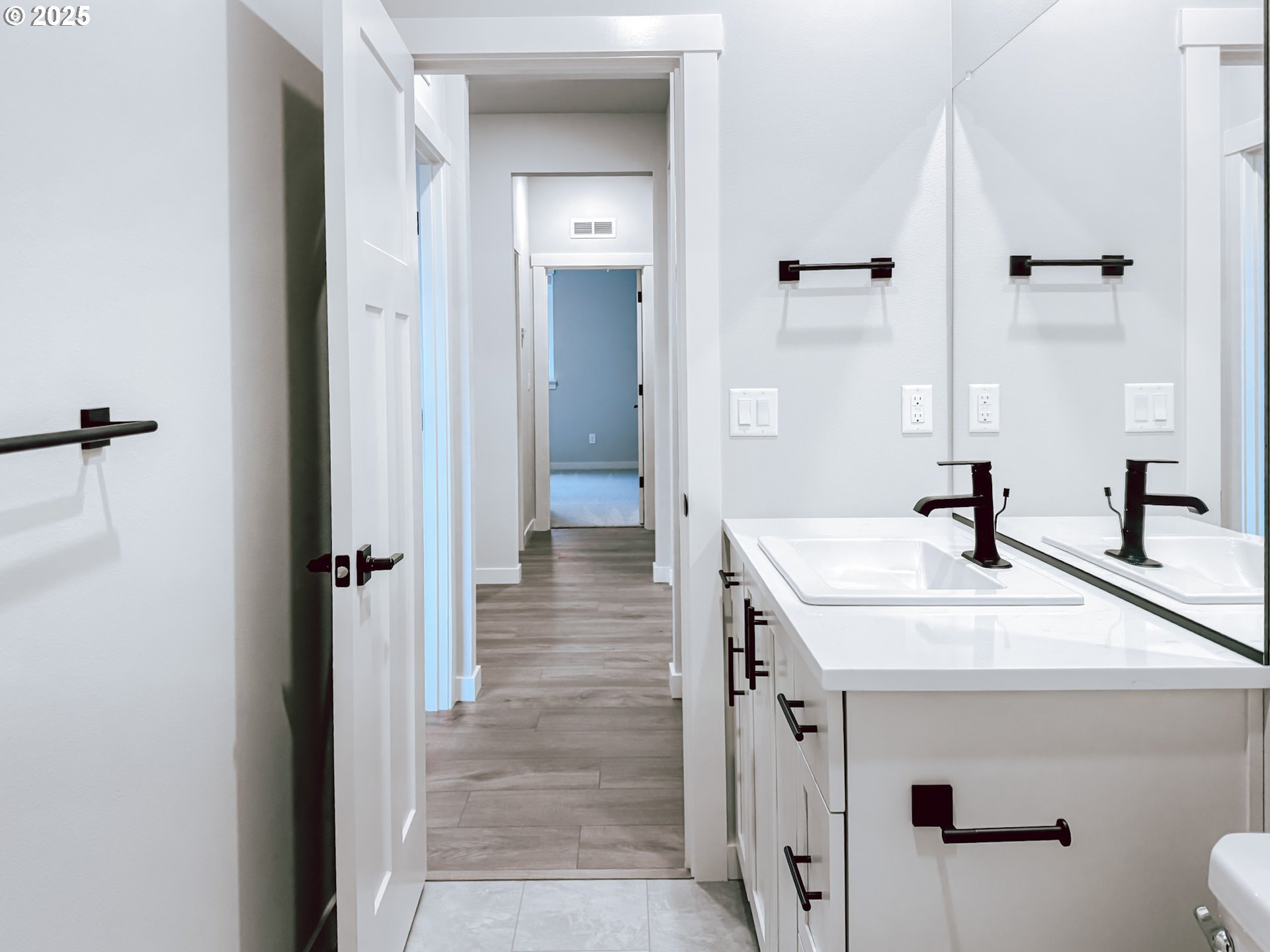 2509 South 4th Way Ridgefield, WA 98642 - Photo 9 of 45 a bathroom with a sink and a mirror