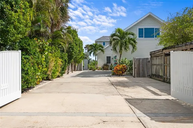 a view of a house with a yard and plant