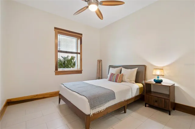a bathroom with a sink toilet double vanity and shower