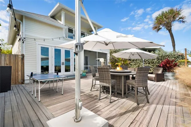 a view of a patio with couches under an umbrella
