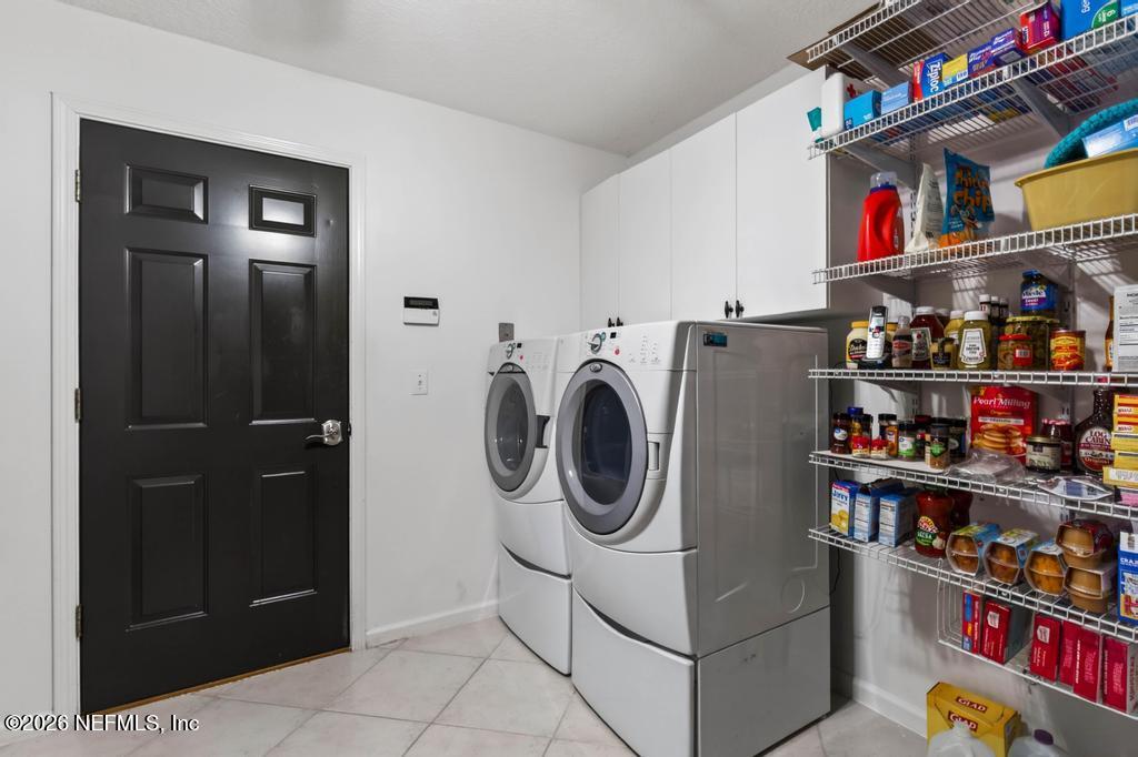 1483 Bridgette Way Fleming Island, FL 32003 - Photo 51 of 63 a utility room with dryer and washer