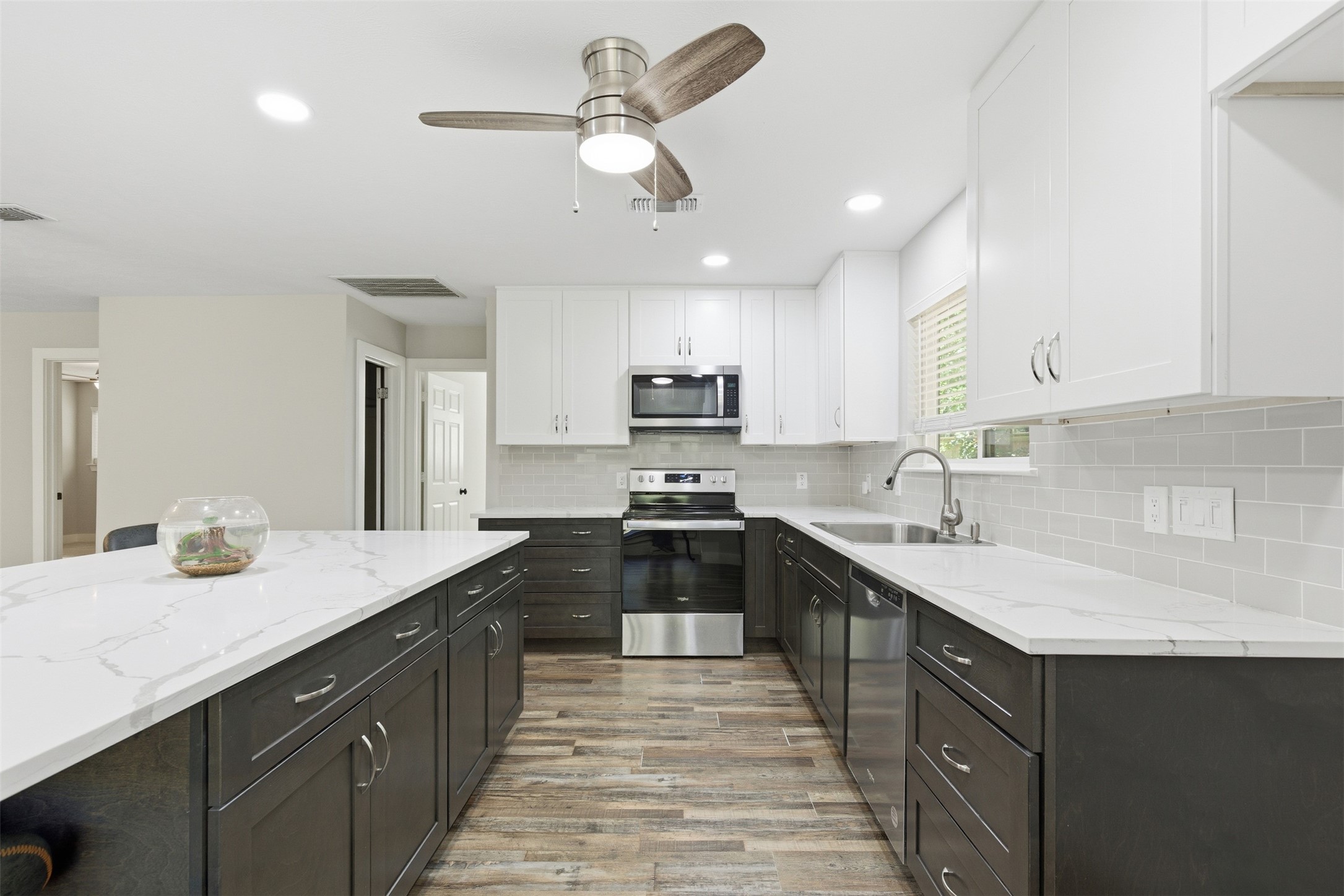 94 Gov Bell Drive Point Blank, TX 77364 - Photo 13 of 49 a kitchen with a sink stainless steel appliances and cabinets