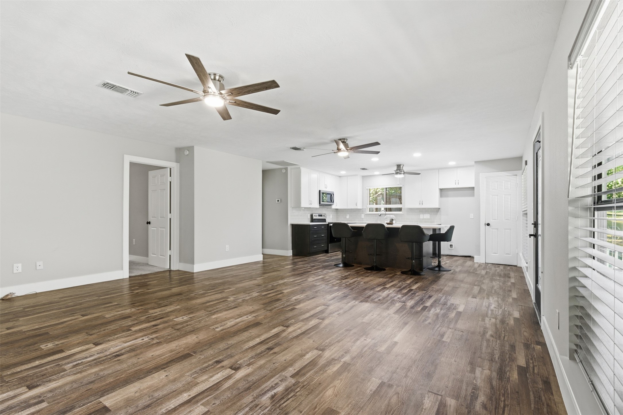 94 Gov Bell Drive Point Blank, TX 77364 - Photo 15 of 49 a living room with furniture and kitchen view