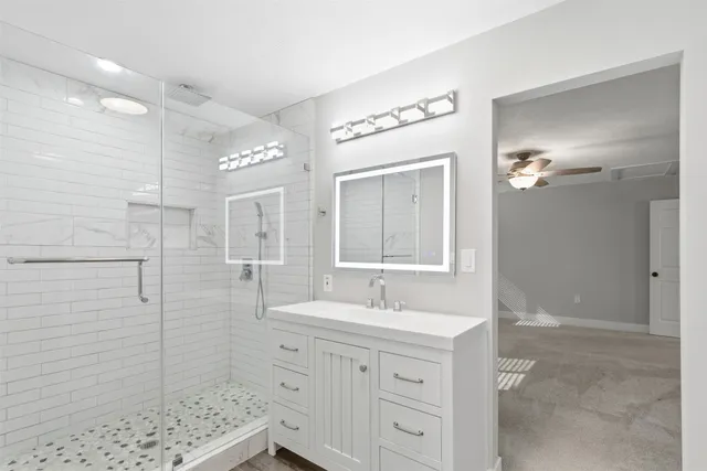 a view of room with window and ceiling fan