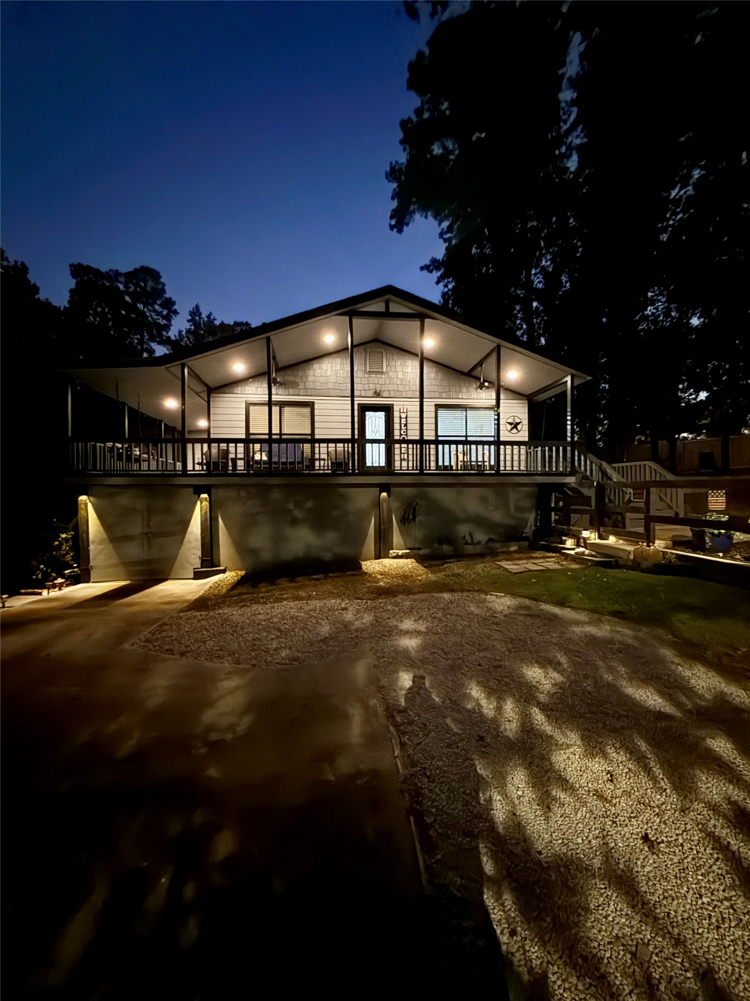 94 Gov Bell Drive Point Blank, TX 77364 - Photo 2 of 49 a large swimming pool with outdoor seating and yard