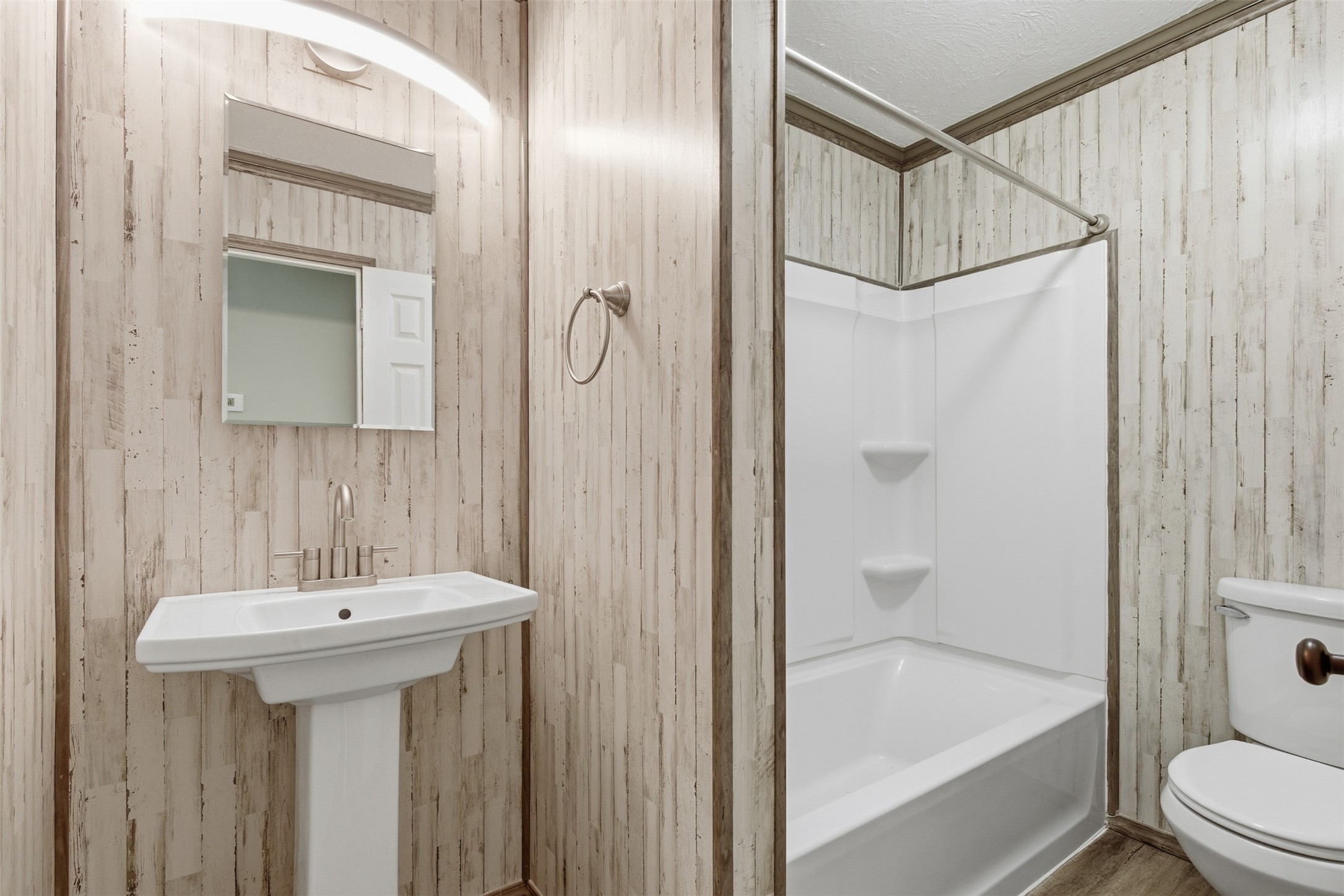 94 Gov Bell Drive Point Blank, TX 77364 - Photo 22 of 49 a bathroom with a sink a mirror toilet and bathtub