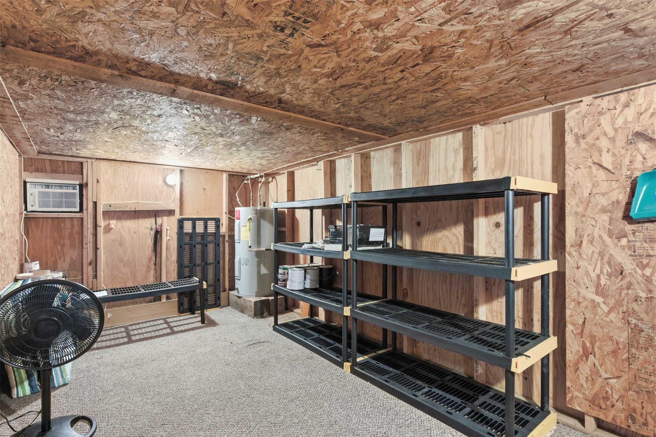 94 Gov Bell Drive Point Blank, TX 77364 - Photo 29 of 49 Discover a hidden gem — a fully functional game room tucked away under the home, complete with its own window unit AC. Perfect for a man-cave, she-shed, home office, playroom, or creative studio — the possibilities are endless!