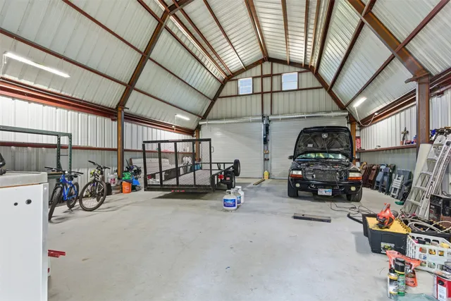 a view of staircase with railing and white walls