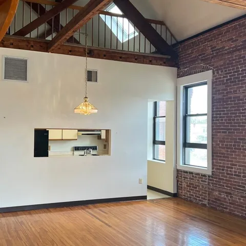 a kitchen with stainless steel appliances a sink stove and cabinets