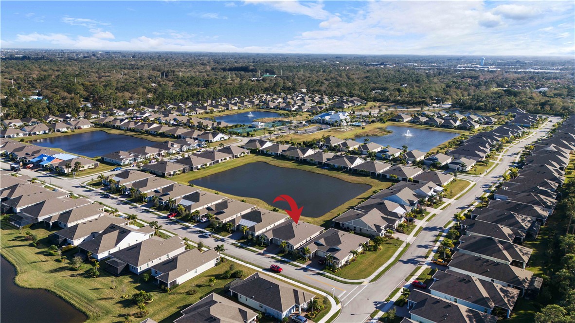 6187 Red Maple Manor Vero Beach, FL 32966 - Photo 31 of 31 an aerial view of residential houses with city view