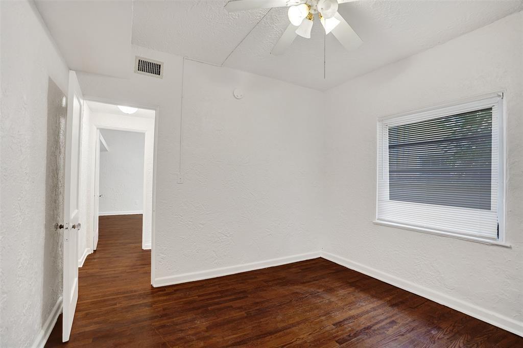 1818 Florida Avenue West Palm Beach, FL 33401 - Photo 26 of 50 a view of an empty room with wooden floor and a window