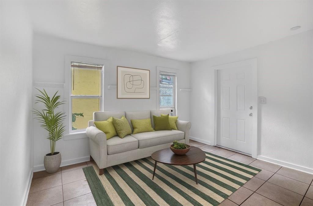 1818 Florida Avenue West Palm Beach, FL 33401 - Photo 29 of 50 a living room with furniture and a rug