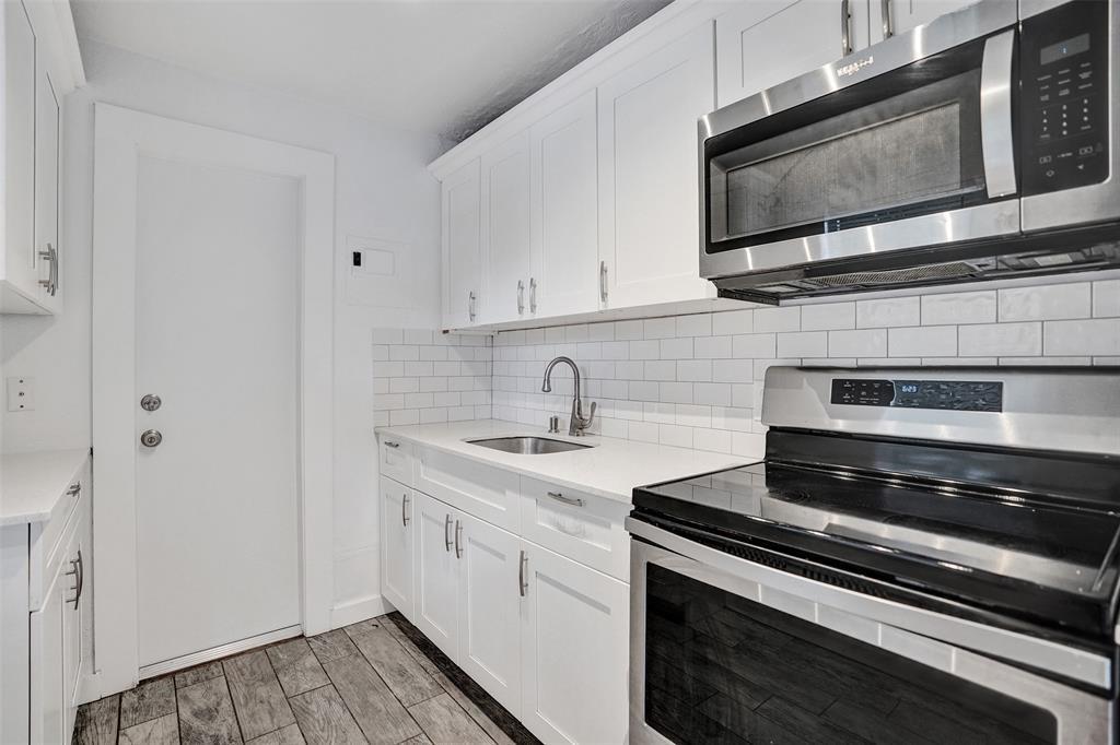 1818 Florida Avenue West Palm Beach, FL 33401 - Photo 30 of 50 a kitchen with a stove microwave and sink