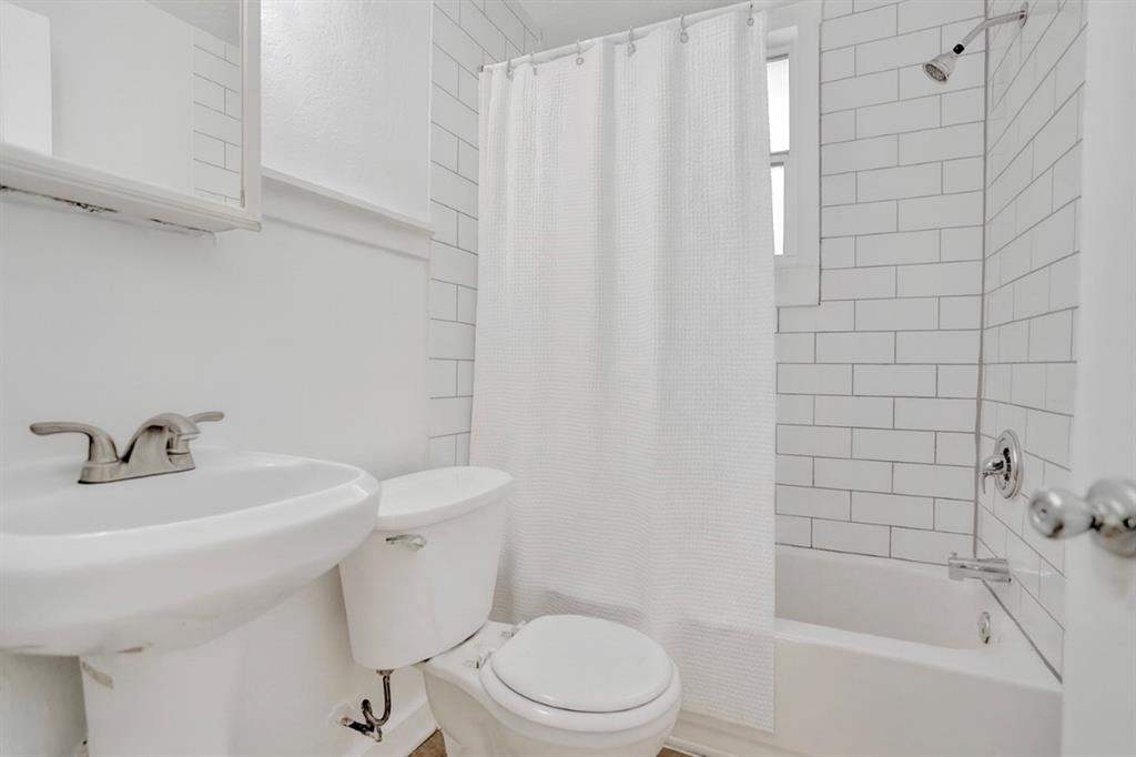 1818 Florida Avenue West Palm Beach, FL 33401 - Photo 34 of 50 a bathroom with a sink a toilet and shower