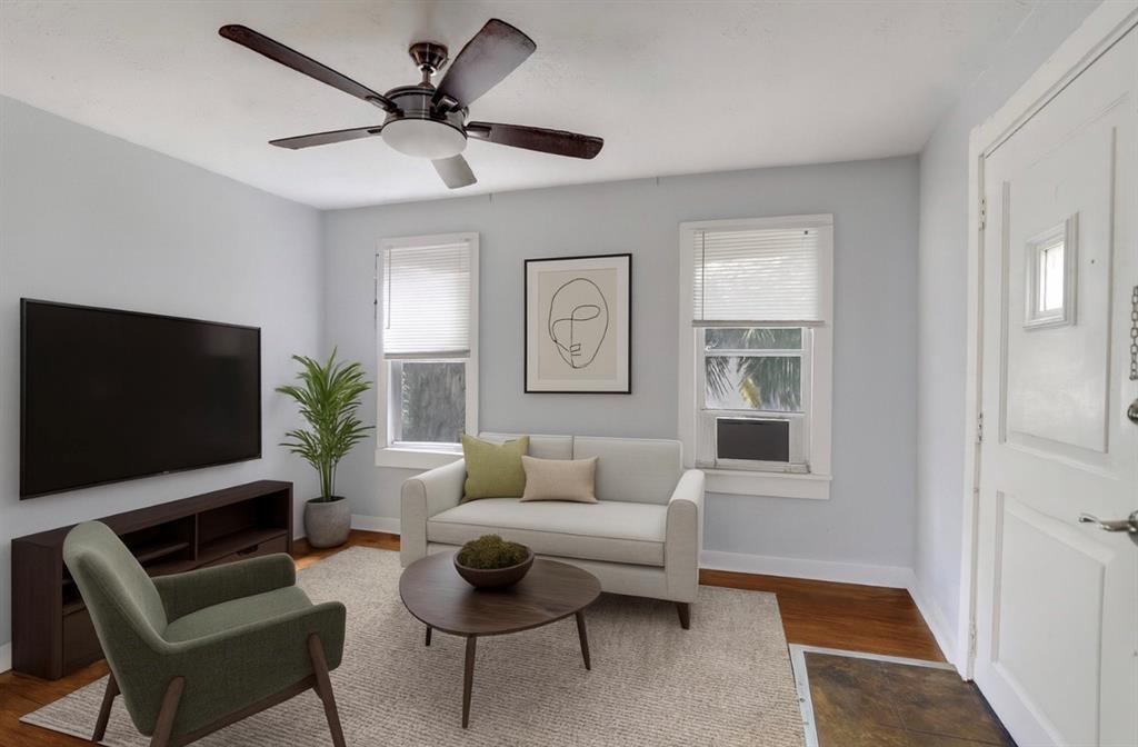 1818 Florida Avenue West Palm Beach, FL 33401 - Photo 38 of 50 a living room with furniture and a flat screen tv