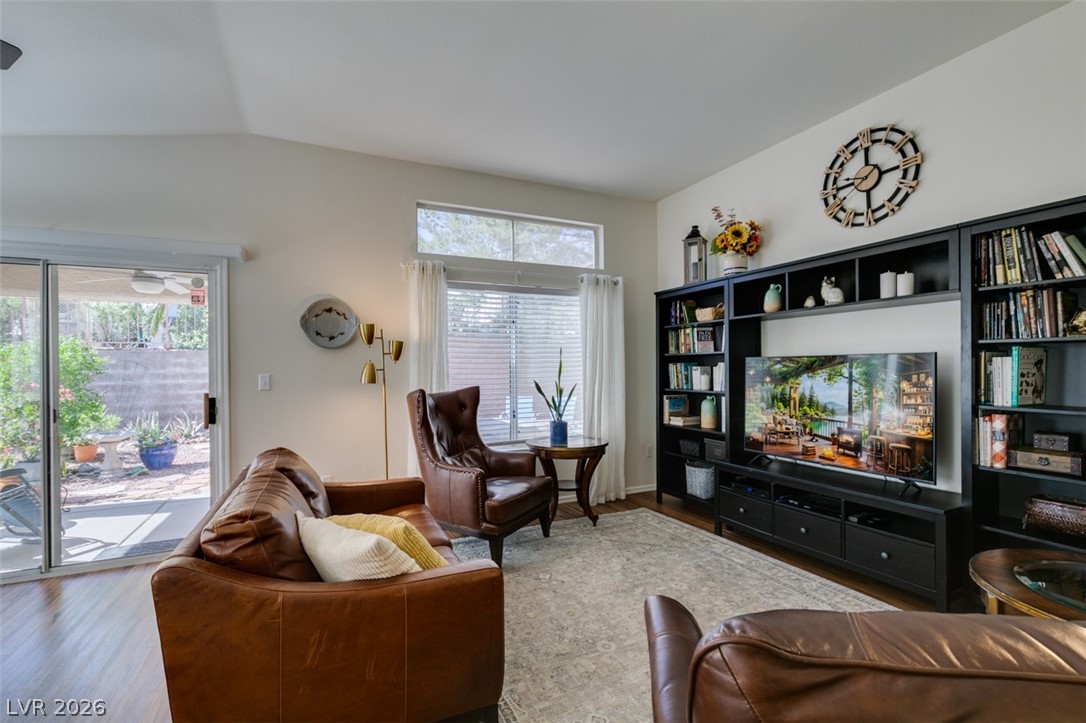 2187 Chapman Ranch Drive Henderson, NV 89012 - Photo 3 of 26 Bright and airy living room with vaulted ceilings and outdoor access.