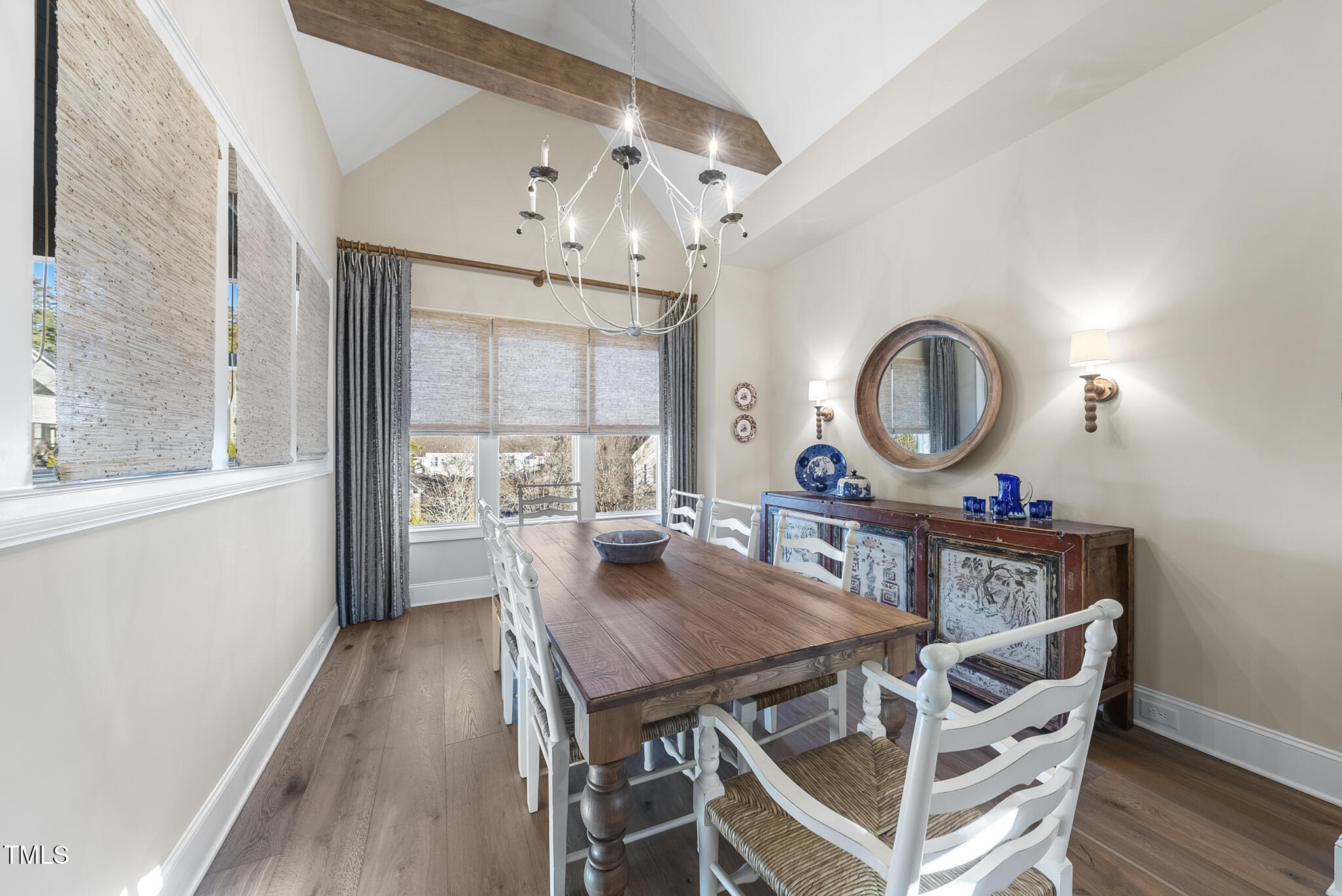 3018 Farrior Road Raleigh, NC 27607 - Photo 14 of 59 a view of a dining room with furniture a chandelier and wooden floor