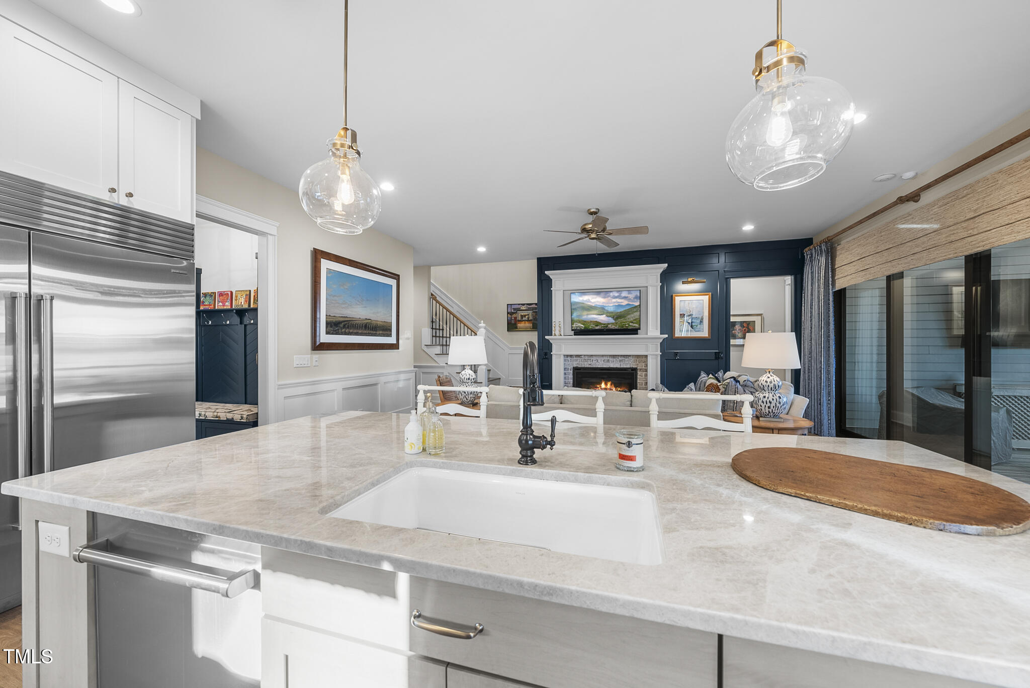 3018 Farrior Road Raleigh, NC 27607 - Photo 16 of 59 a kitchen with stainless steel appliances granite countertop a sink a stove and a refrigerator