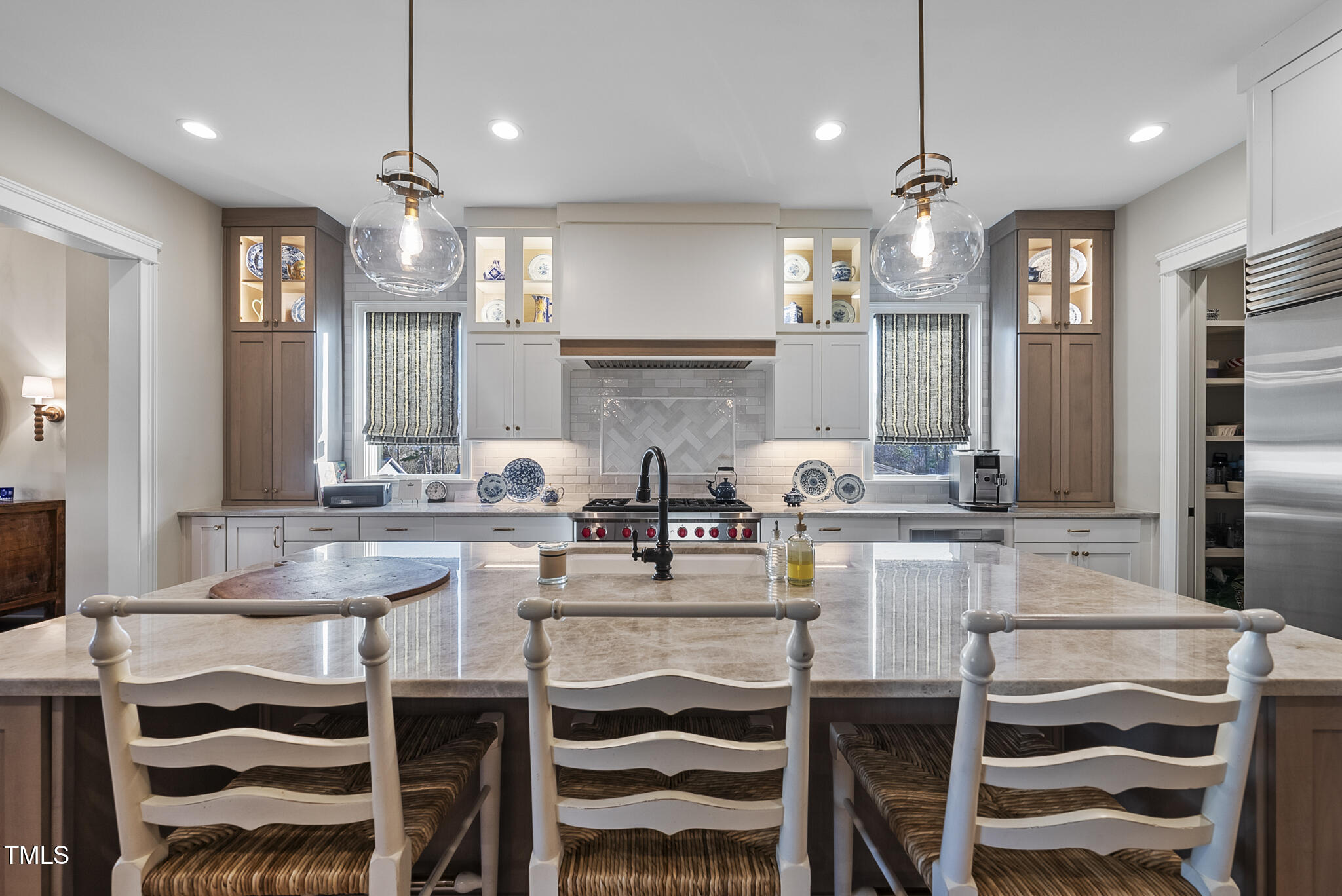 3018 Farrior Road Raleigh, NC 27607 - Photo 18 of 59 a kitchen with kitchen island granite countertop a table and chairs