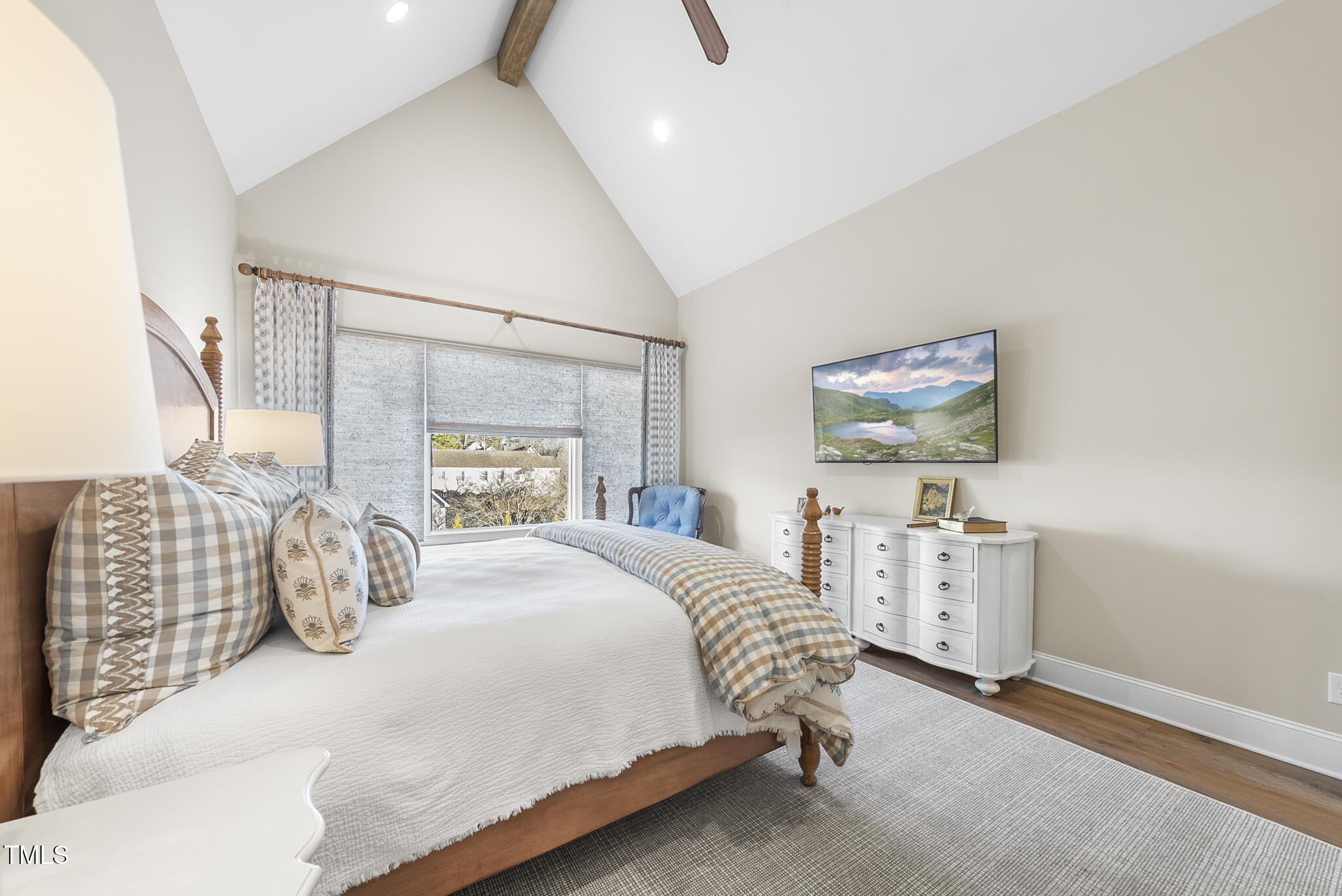 3018 Farrior Road Raleigh, NC 27607 - Photo 19 of 59 a bedroom with a bed and a chandelier